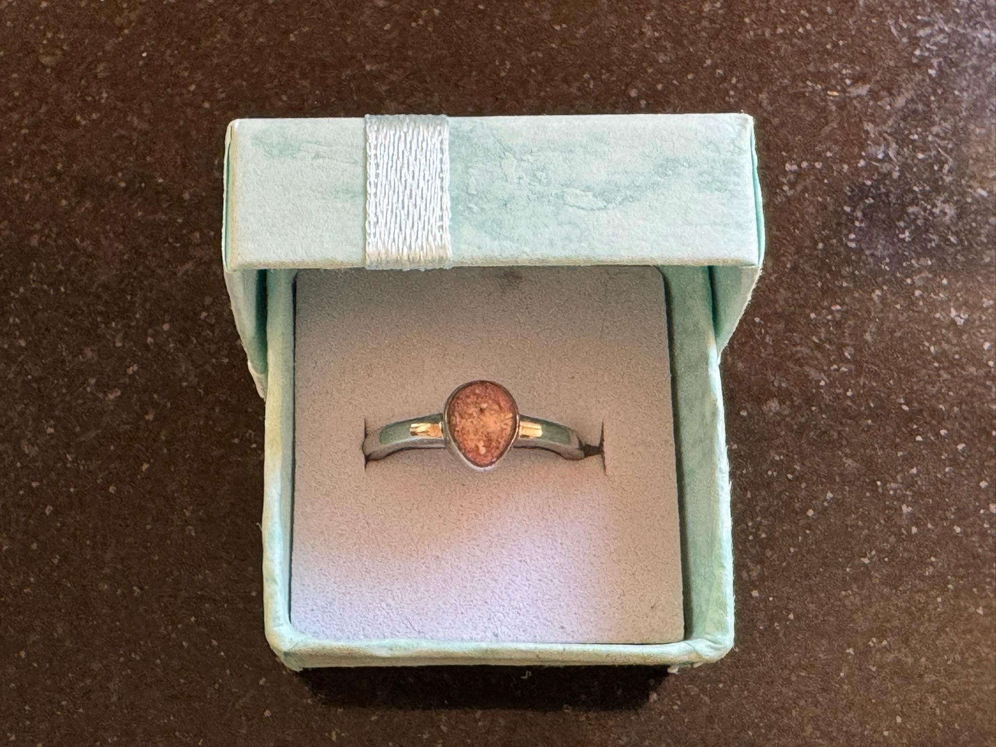 Memorial ring displayed in a keepsake box